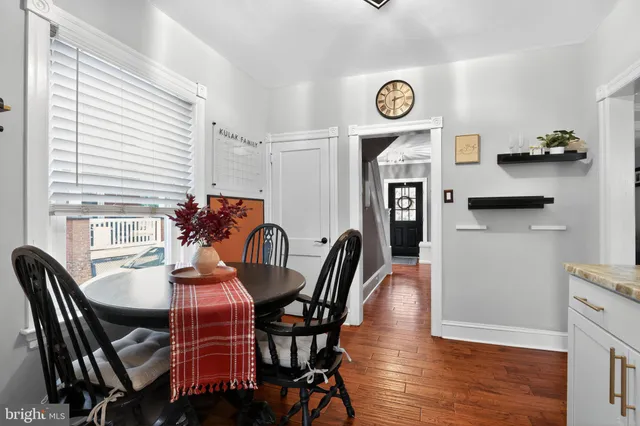 a view of a dining room with furniture and a window