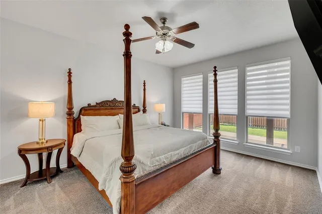 a bed room with a bed and a chandelier