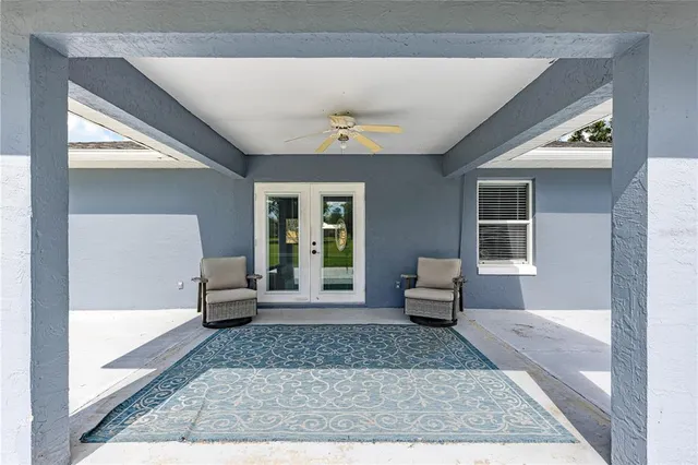 a living room with furniture and a rug