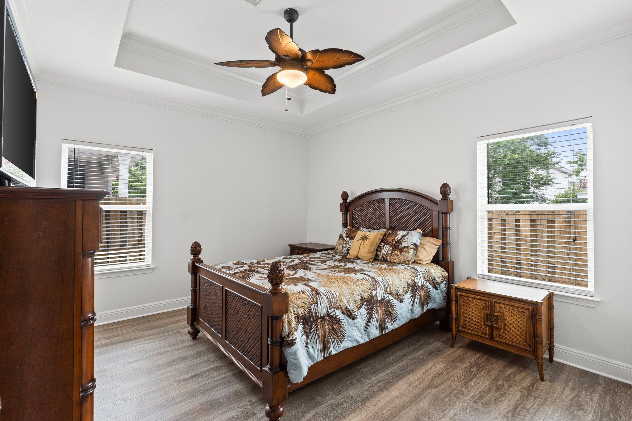 102 Turtle Cove Panama City Beach, FL 32413 - Photo 14 of 42 a bedroom with a bed and a window