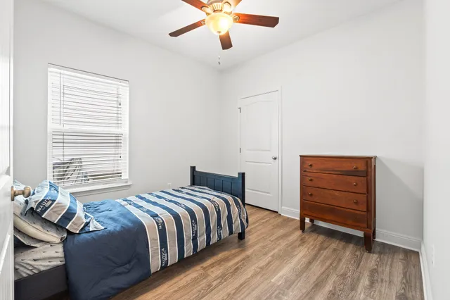 a bedroom with a bed and a dresser