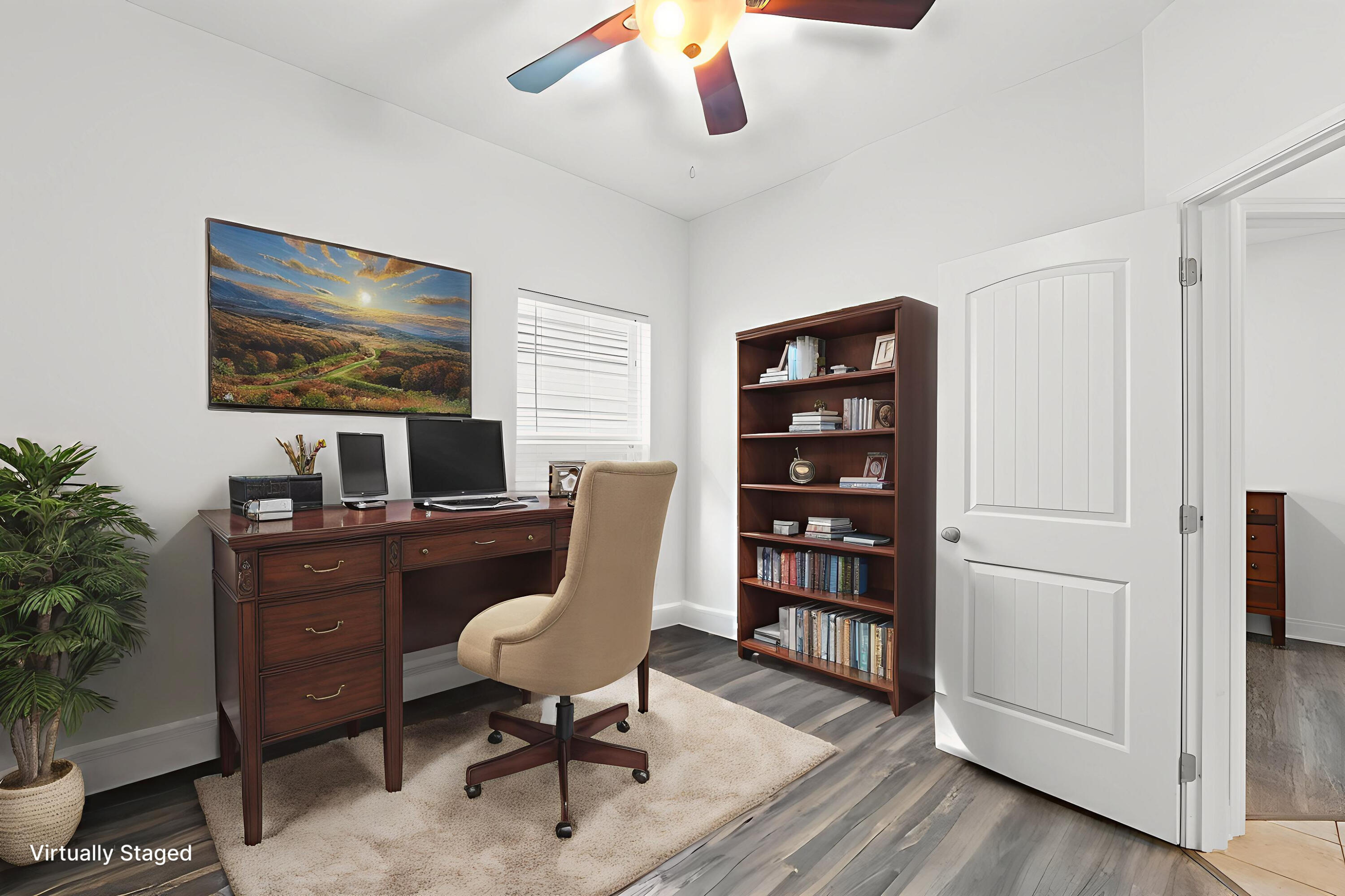 102 Turtle Cove Panama City Beach, FL 32413 - Photo 21 of 42 a view of a workspace with furniture and a potted plant