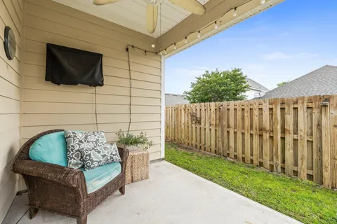 a view of a door and chair in the patio