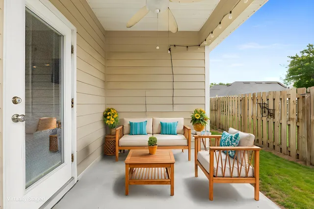 a balcony with furniture and garden view