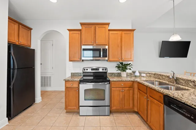 a kitchen with a stove microwave and refrigerator