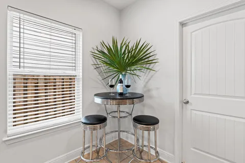 a view of a room with a potted plant and a window