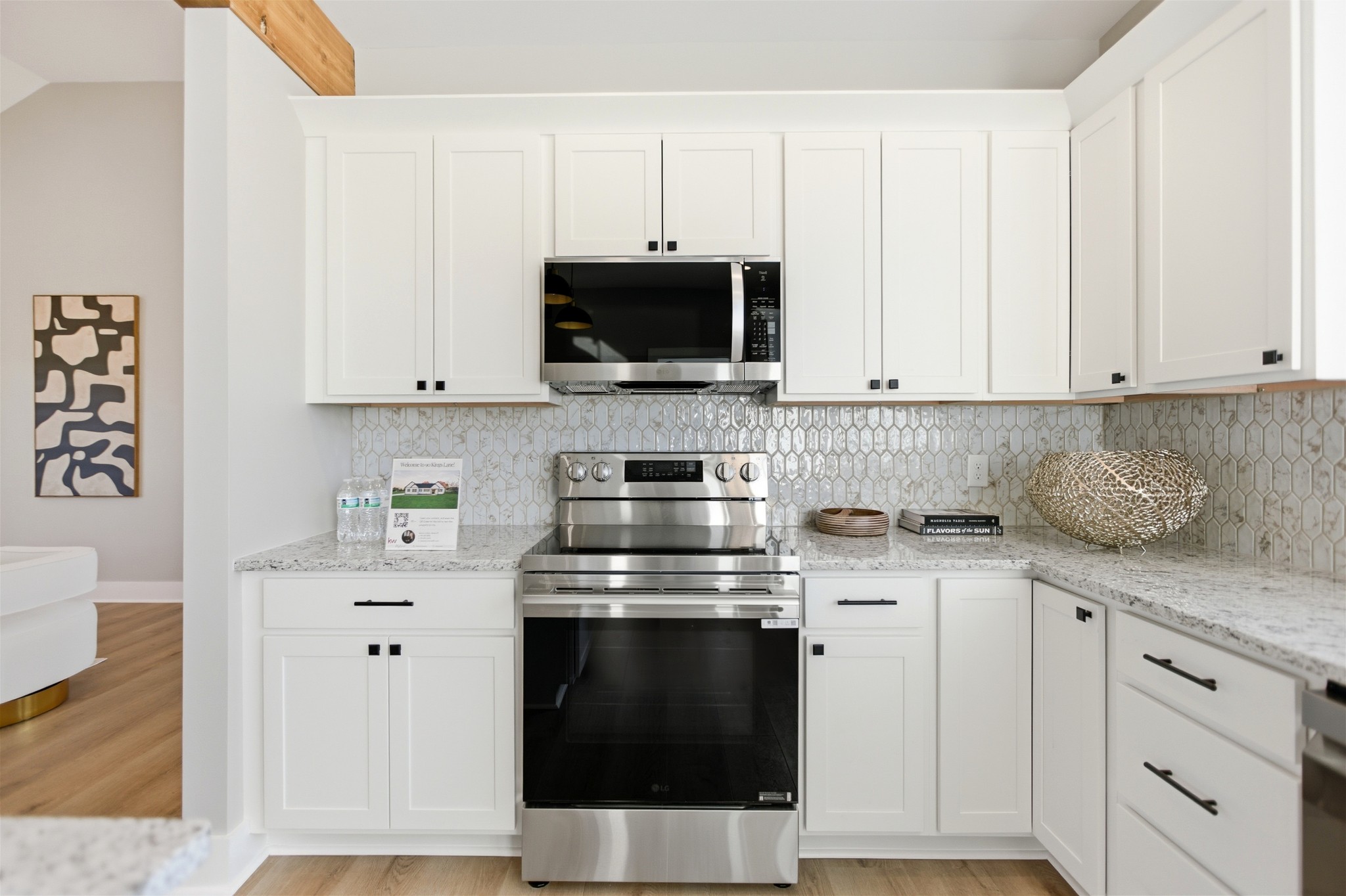 90 Kings Lane Tullahoma, TN 37388 - Photo 13 of 39 a kitchen with granite countertop white cabinets and black stainless steel appliances