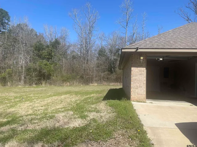 a view of empty room with furniture