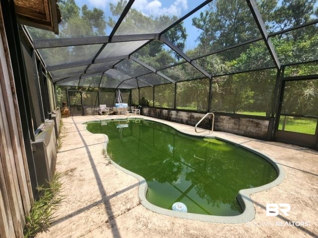 32749 Antietam Road Lillian, AL 36549 - Photo 36 of 47 View of swimming pool with a patio area and a lanai