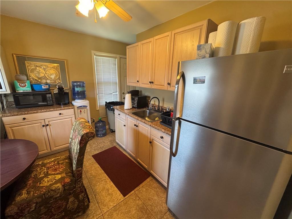 2417 Freeport Road Natrona Heights, PA 15065 - Photo 8 of 15 a kitchen with stainless steel appliances a refrigerator sink and white cabinets