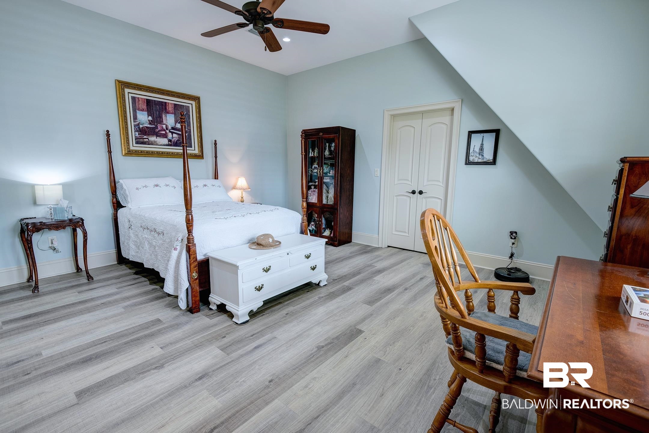 9357 Lakeview Drive Foley, AL 36535 - Photo 64 of 68 Spacious room featuring wood-finish flooring, a ceiling fan, and light blue walls