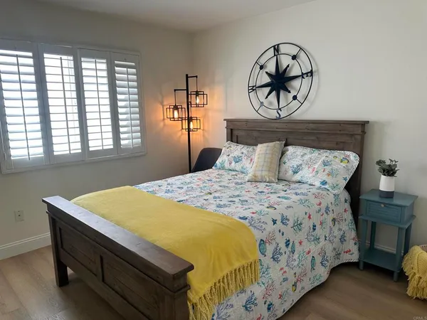 a bedroom with a bed and window