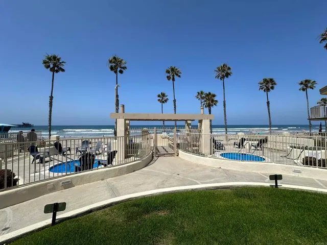 a view of a swimming pool with a lawn chairs