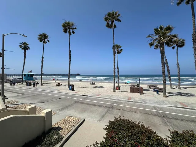 a view of a swimming pool with a table and chairs
