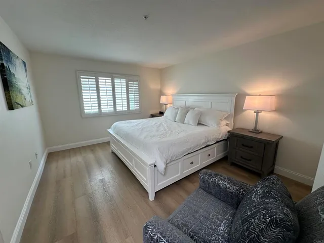a living room with a bed furniture and a window