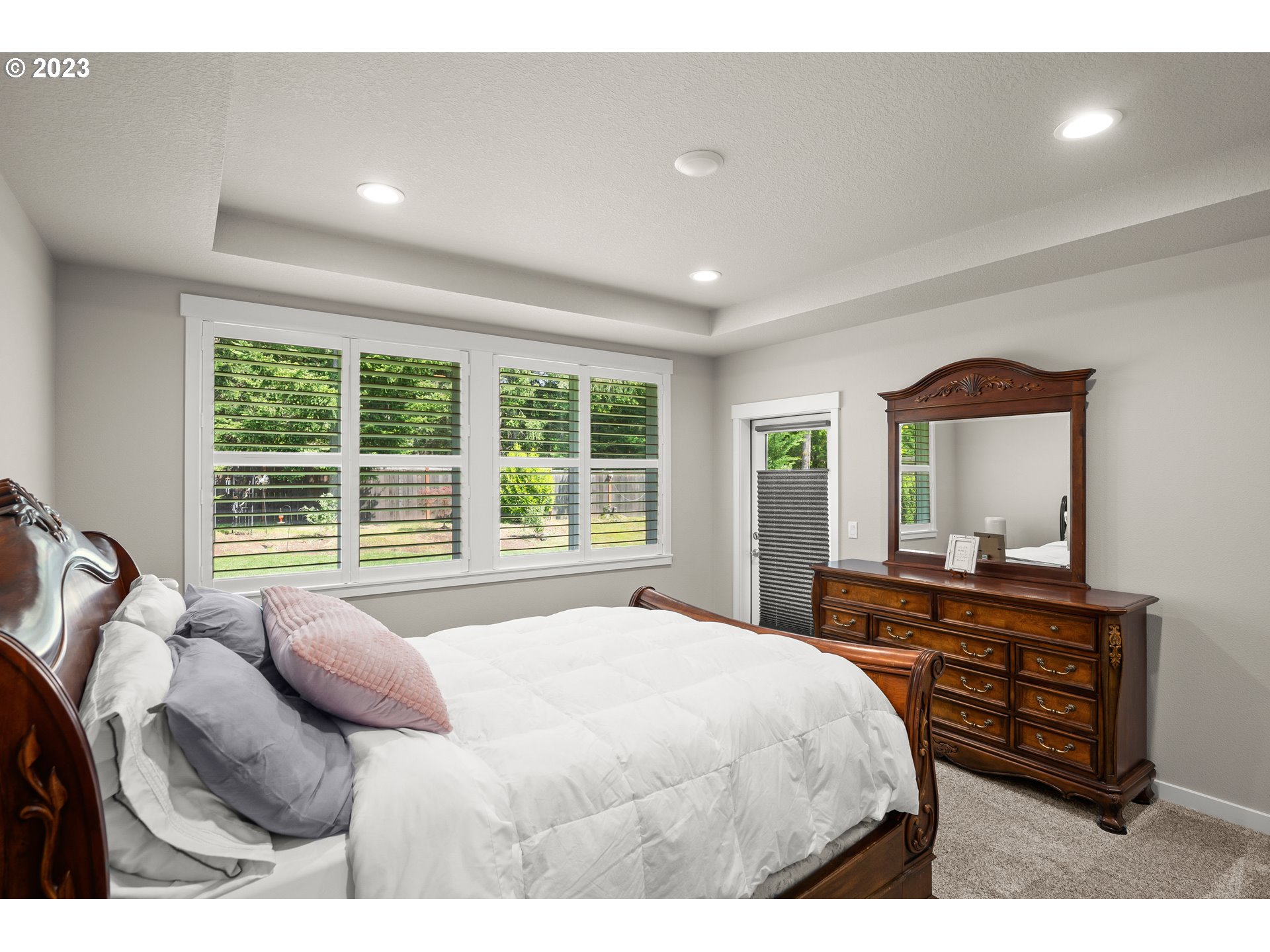 16316 Kitty Hawk Avenue Oregon City, OR 97045 - Photo 14 of 29 a bedroom with a bed window and dresser