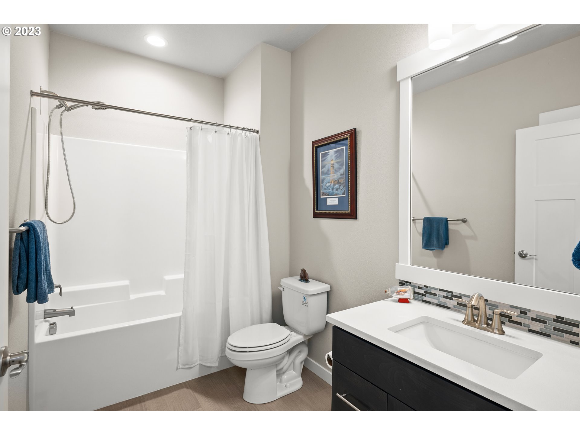 16316 Kitty Hawk Avenue Oregon City, OR 97045 - Photo 20 of 29 a bathroom with a sink a toilet and a mirror