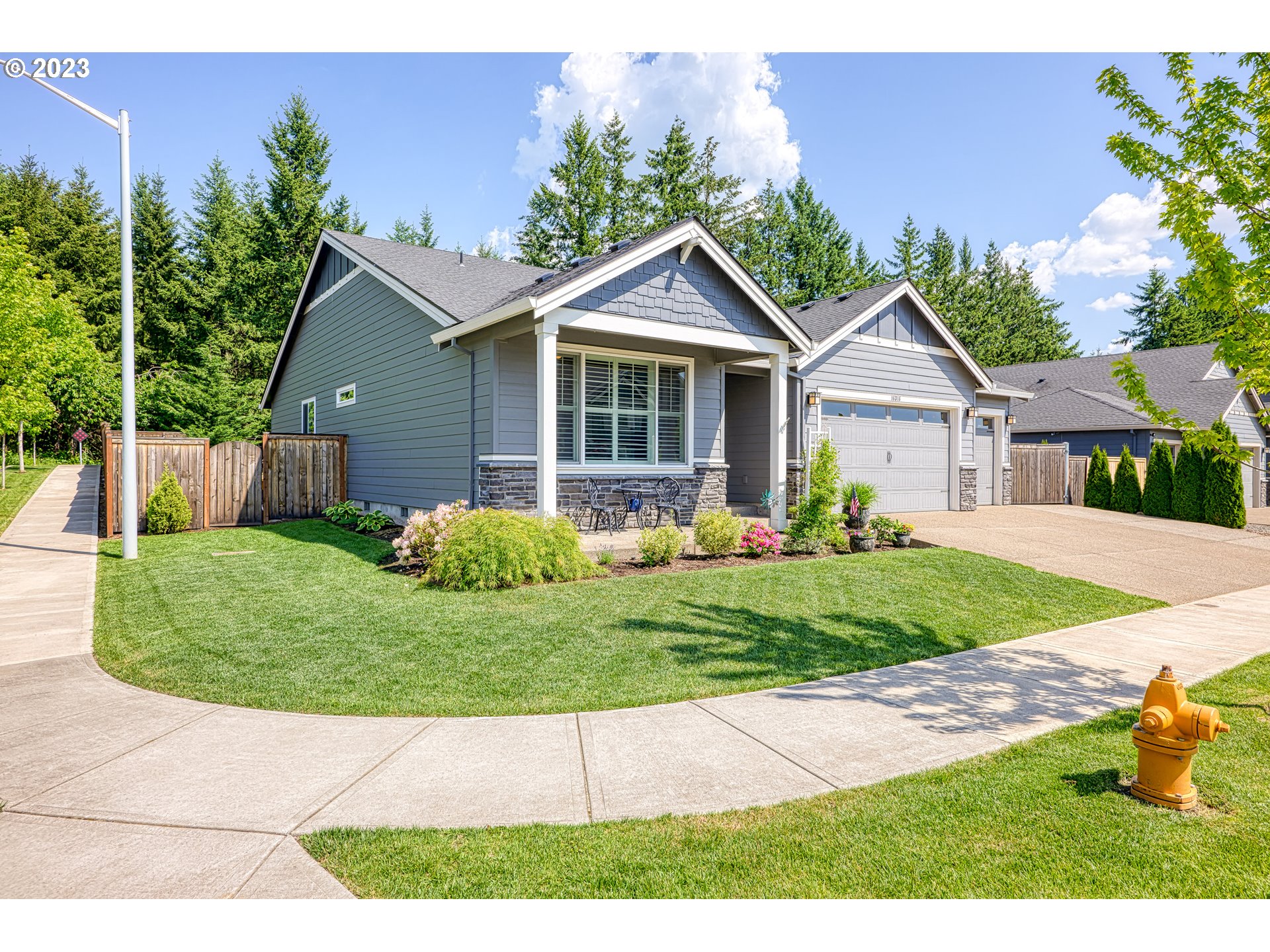 16316 Kitty Hawk Avenue Oregon City, OR 97045 - Photo 2 of 29 a view of a house with a yard and potted plants