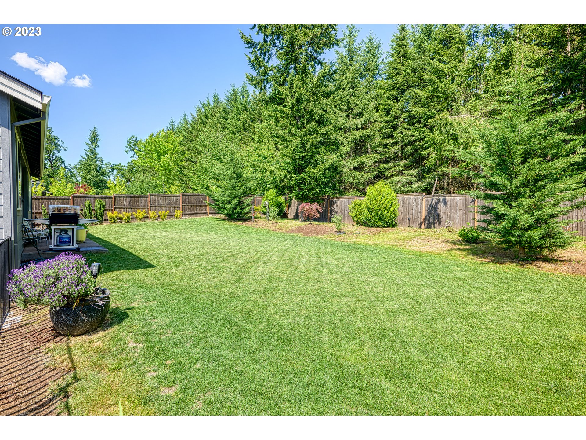 16316 Kitty Hawk Avenue Oregon City, OR 97045 - Photo 23 of 29 a view of a backyard