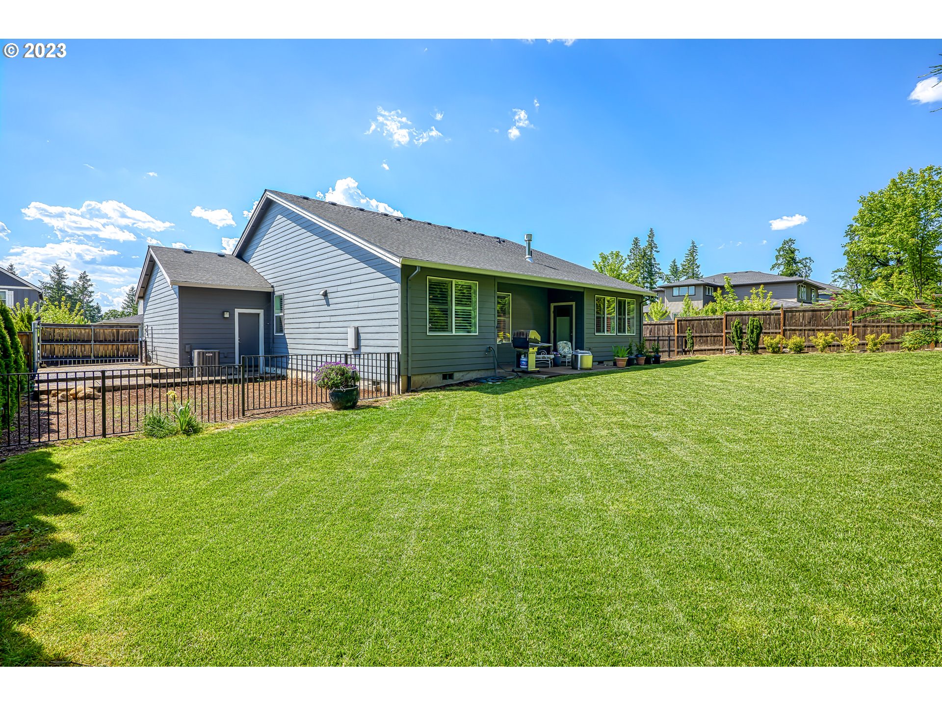 16316 Kitty Hawk Avenue Oregon City, OR 97045 - Photo 25 of 29 a view of a house with a yard porch and sitting area