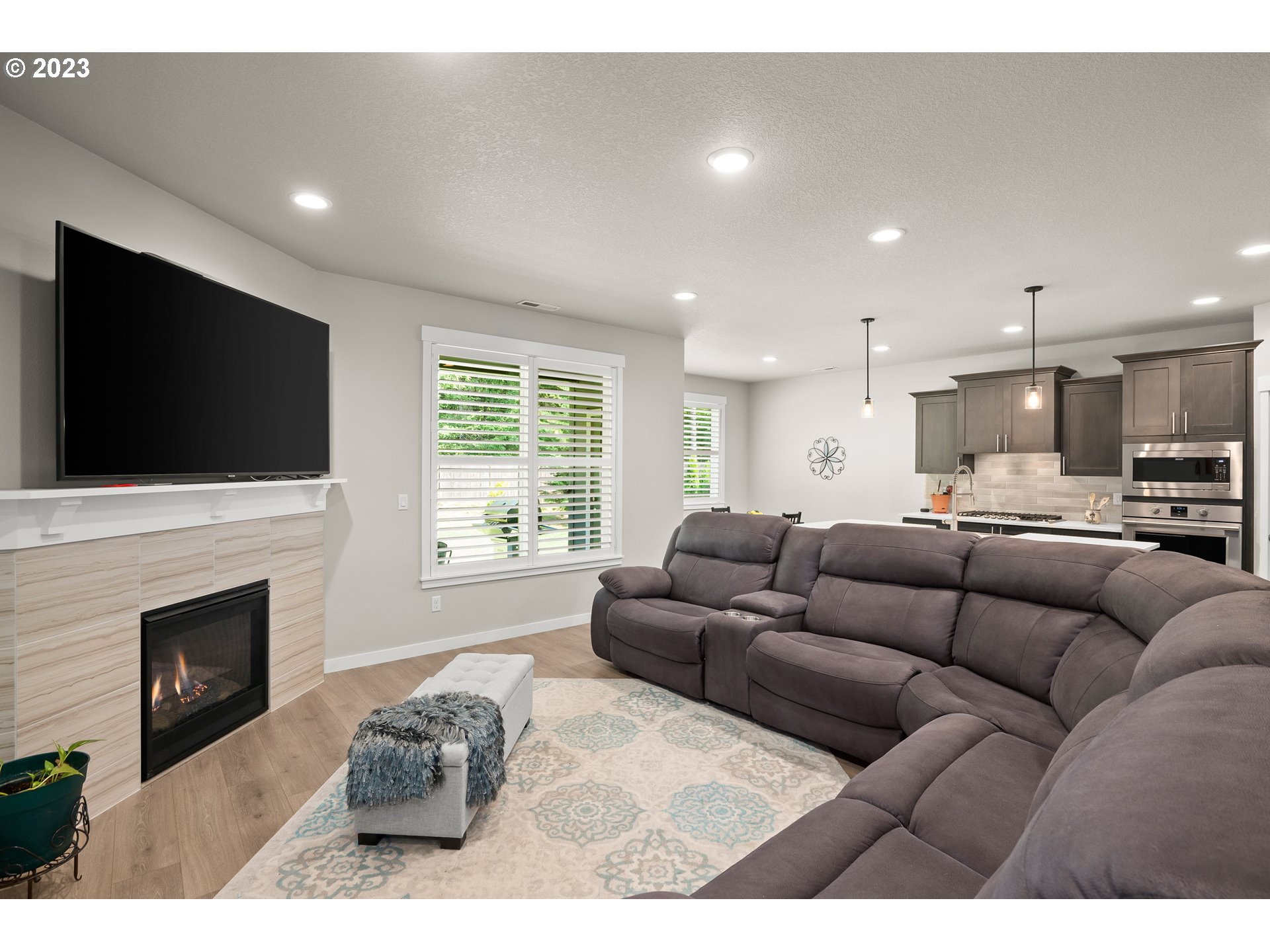 16316 Kitty Hawk Avenue Oregon City, OR 97045 - Photo 6 of 29 a living room with furniture fireplace and flat screen tv