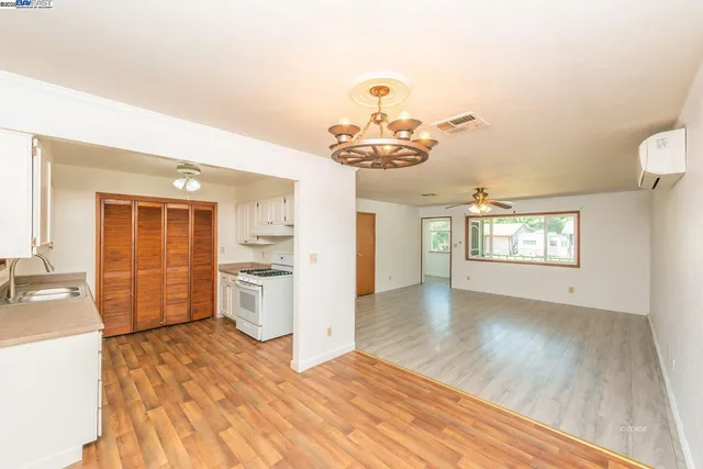 a view of a room with wooden floor and small space