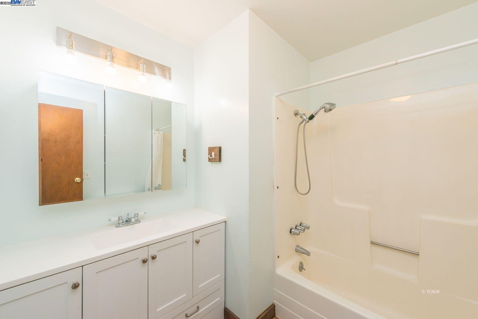 395 Masonic Lane Weaverville, CA 96093 - Photo 18 of 40 a bathroom with a shower sink and mirror