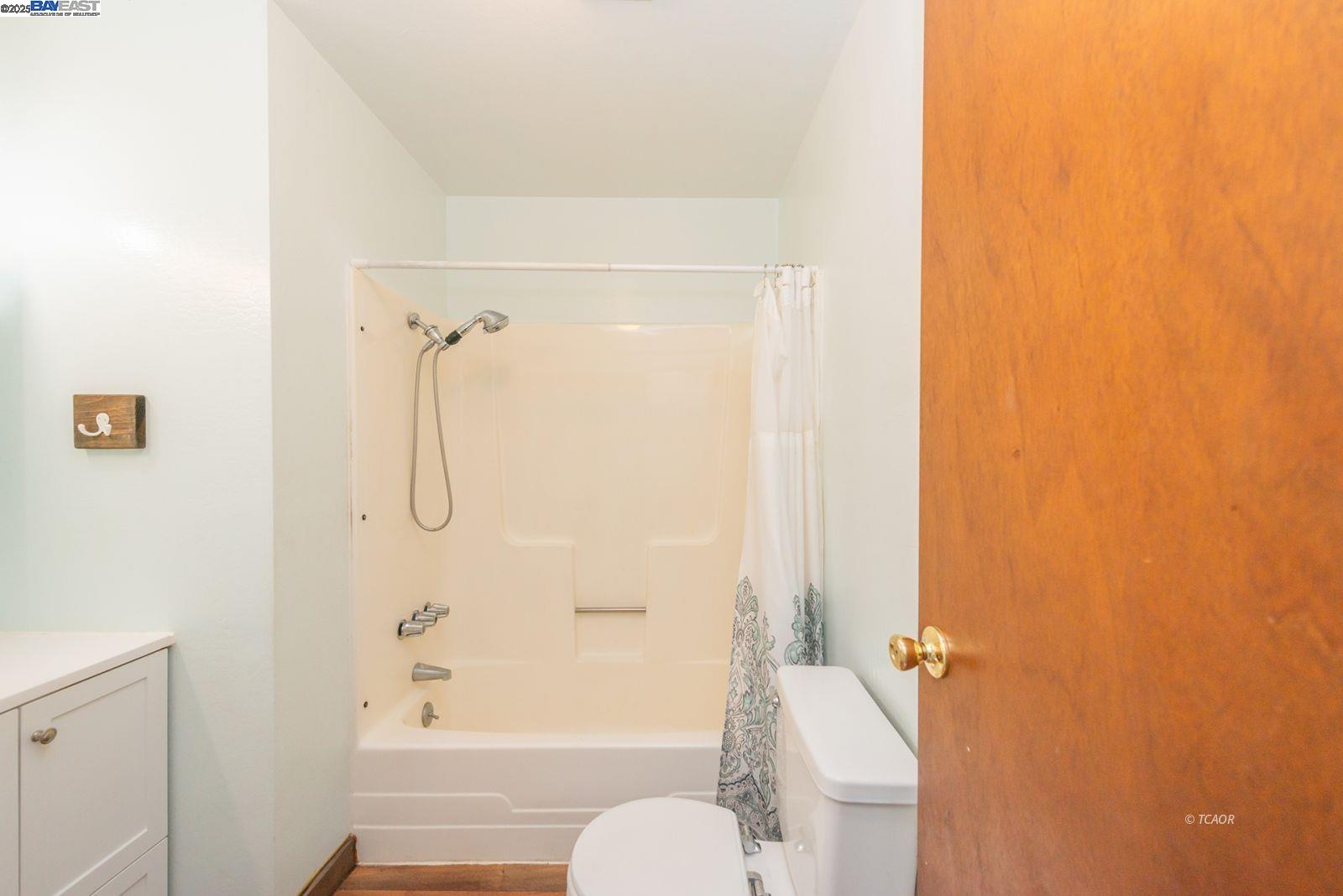 395 Masonic Lane Weaverville, CA 96093 - Photo 19 of 40 a bathroom with a shower curtain