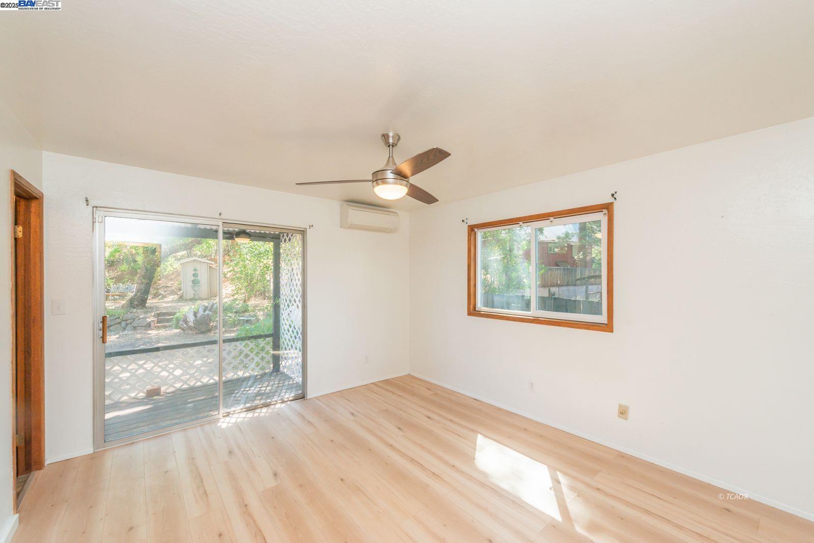 395 Masonic Lane Weaverville, CA 96093 - Photo 23 of 40 a view of empty room with wooden floor and fan