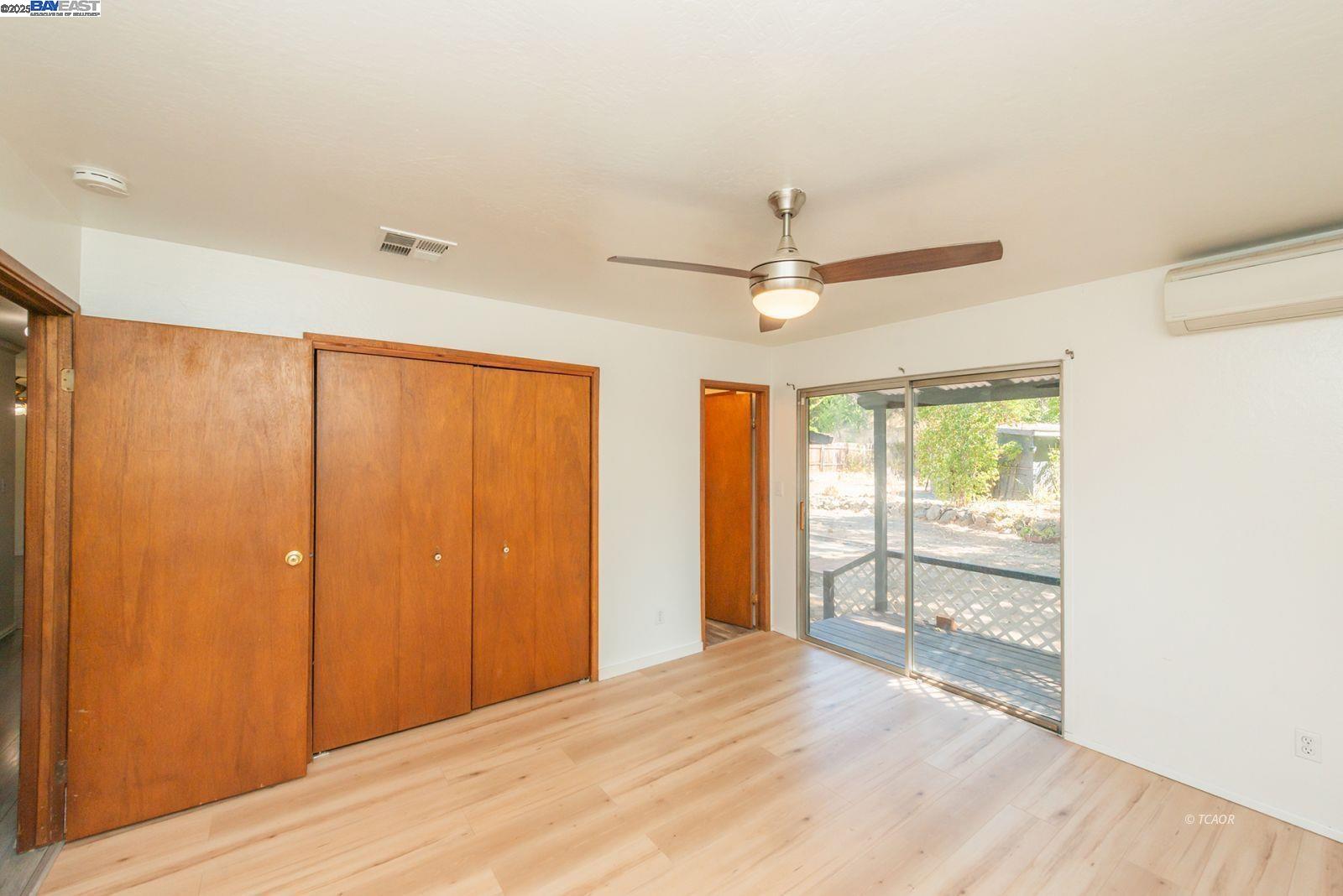 395 Masonic Lane Weaverville, CA 96093 - Photo 24 of 40 a view of an empty room with wooden floor and a window