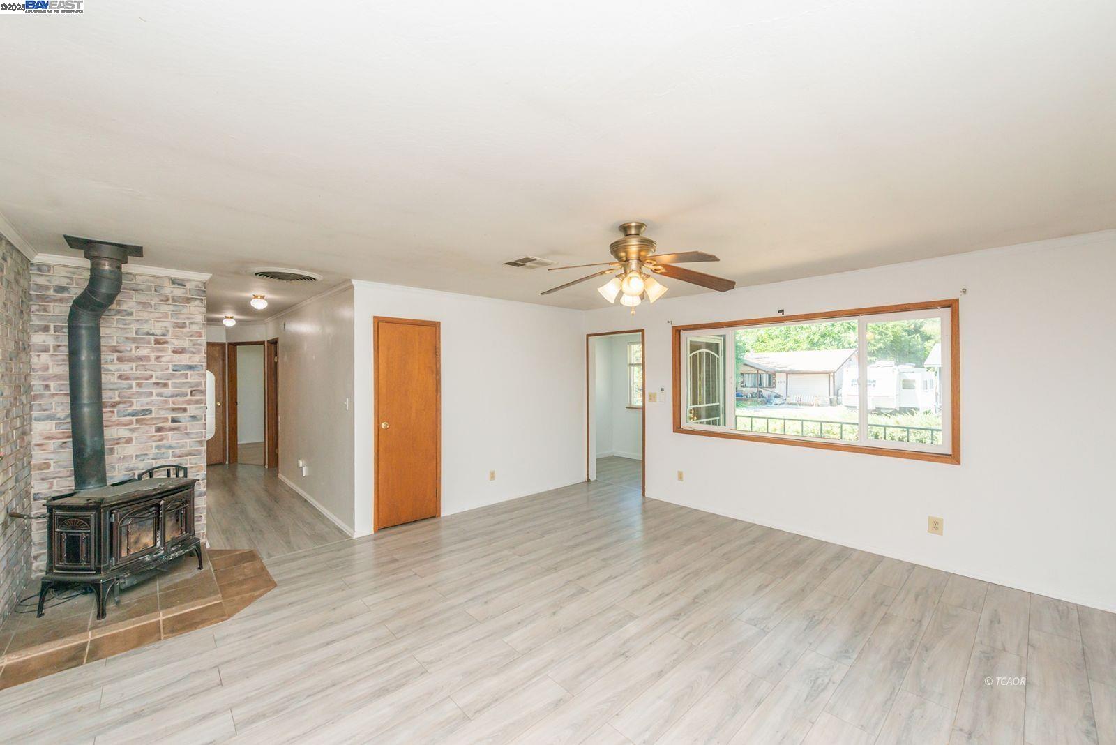 395 Masonic Lane Weaverville, CA 96093 - Photo 3 of 40 wooden floor in an empty room with a window