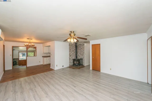 a view of a room with a dishwasher and a dresser