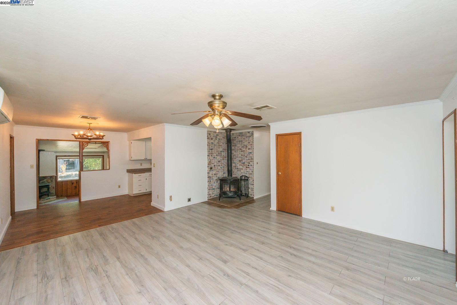 395 Masonic Lane Weaverville, CA 96093 - Photo 6 of 40 wooden floor in an empty room with a window