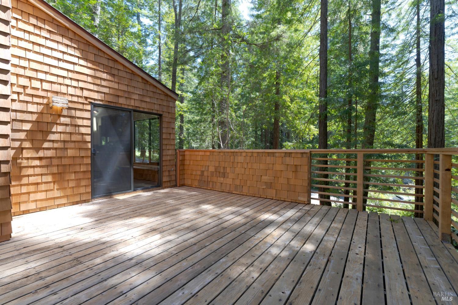 355 Chinquapin Lane The Sea Ranch, CA 95497 - Photo 11 of 31 a view of backyard with a deck and wooden floor