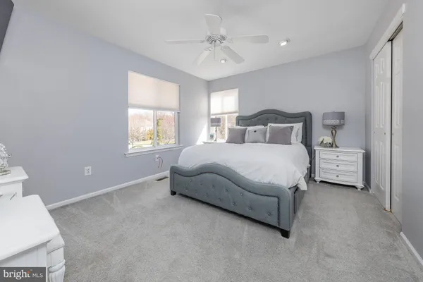 a bedroom with a bed and a tv