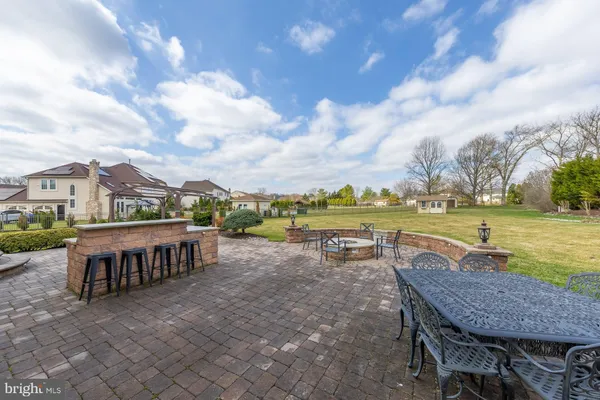 a view of a couches and dinning table and chairs in the patio