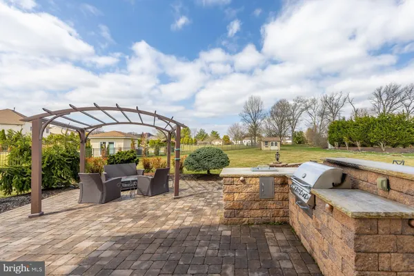 an outdoor space with furniture and garden