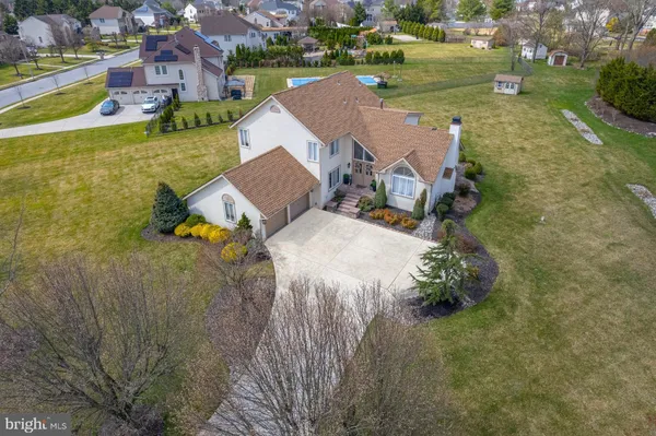 an aerial view of a house with outdoor space