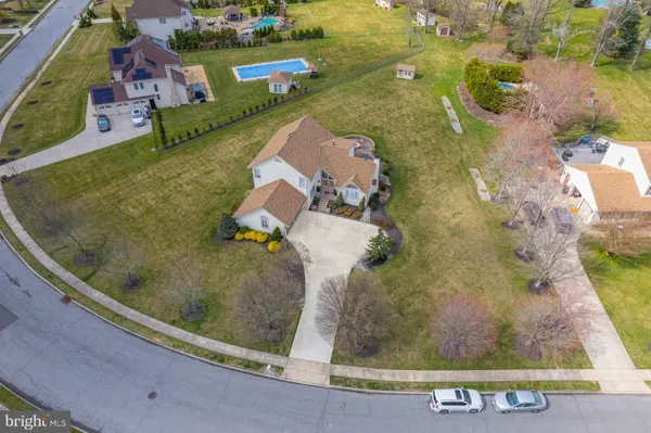 an aerial view of a house with a swimming pool