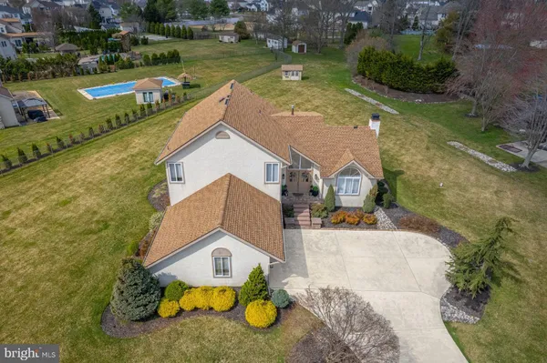 an aerial view of a house with a lake view