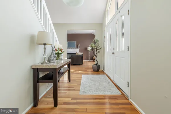 a bedroom with furniture and a wooden floor