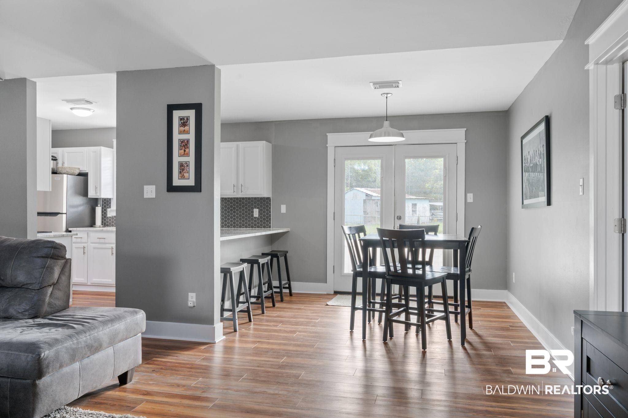 1107 North Oak Street Loxley, AL 36551 - Photo 5 of 40 Dining area featuring hardwood / wood-style floors and french doors