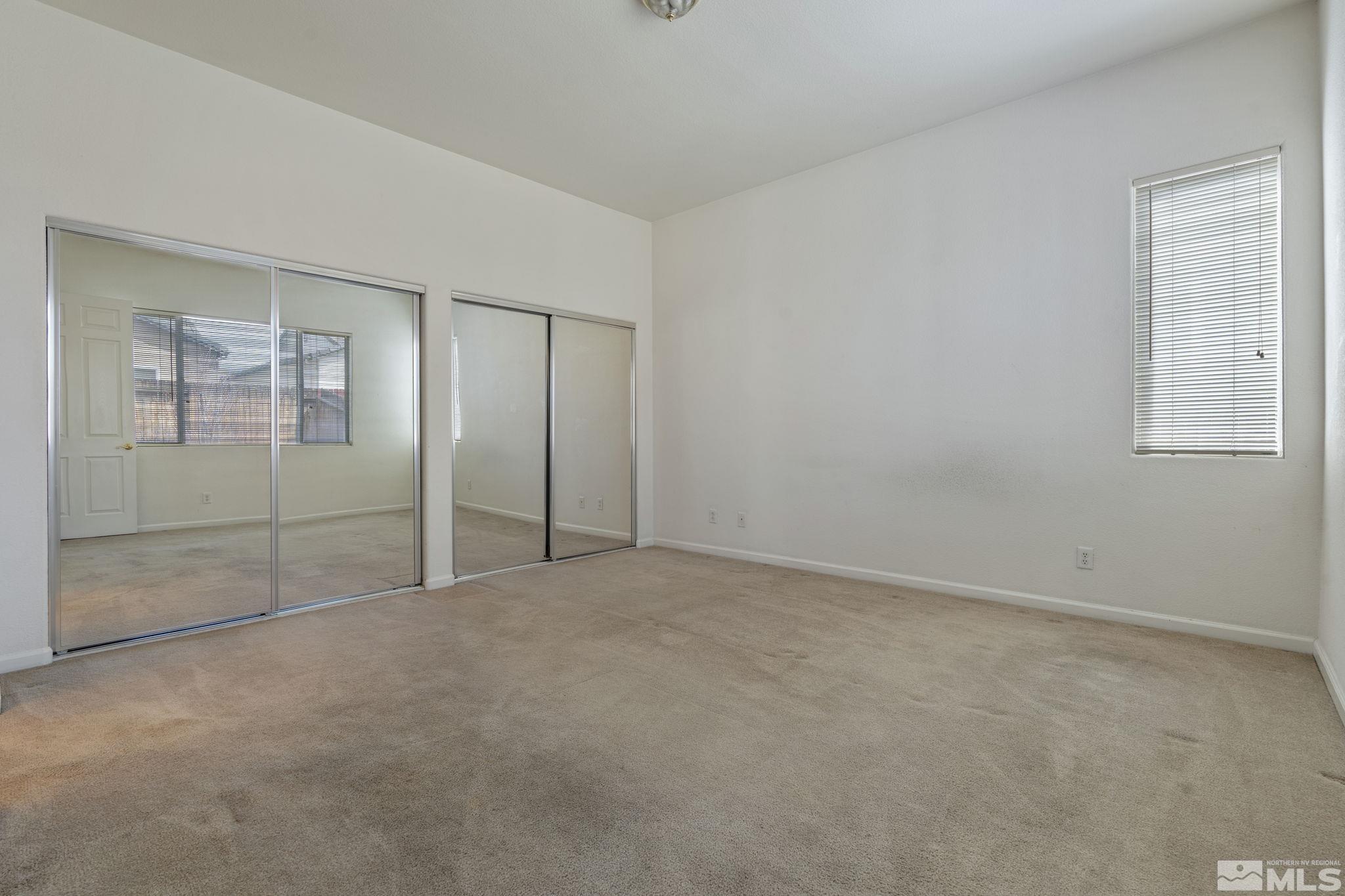 10503 Meeks Bay Court Reno, NV 89521 - Photo 17 of 28 an empty room with windows and closet