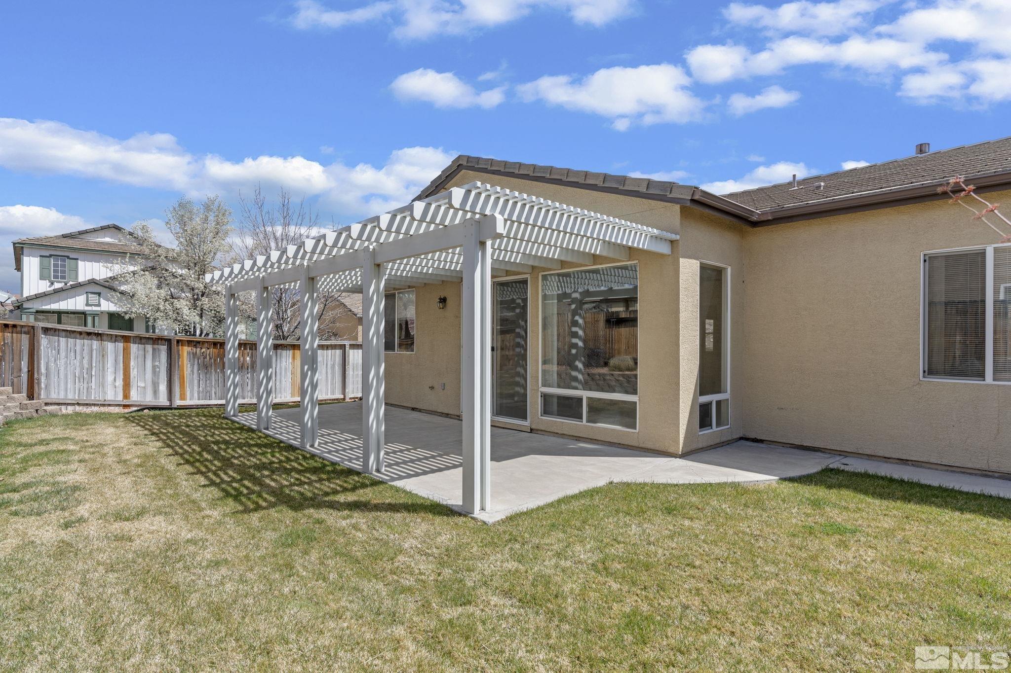 10503 Meeks Bay Court Reno, NV 89521 - Photo 25 of 28 a view of a house with a backyard