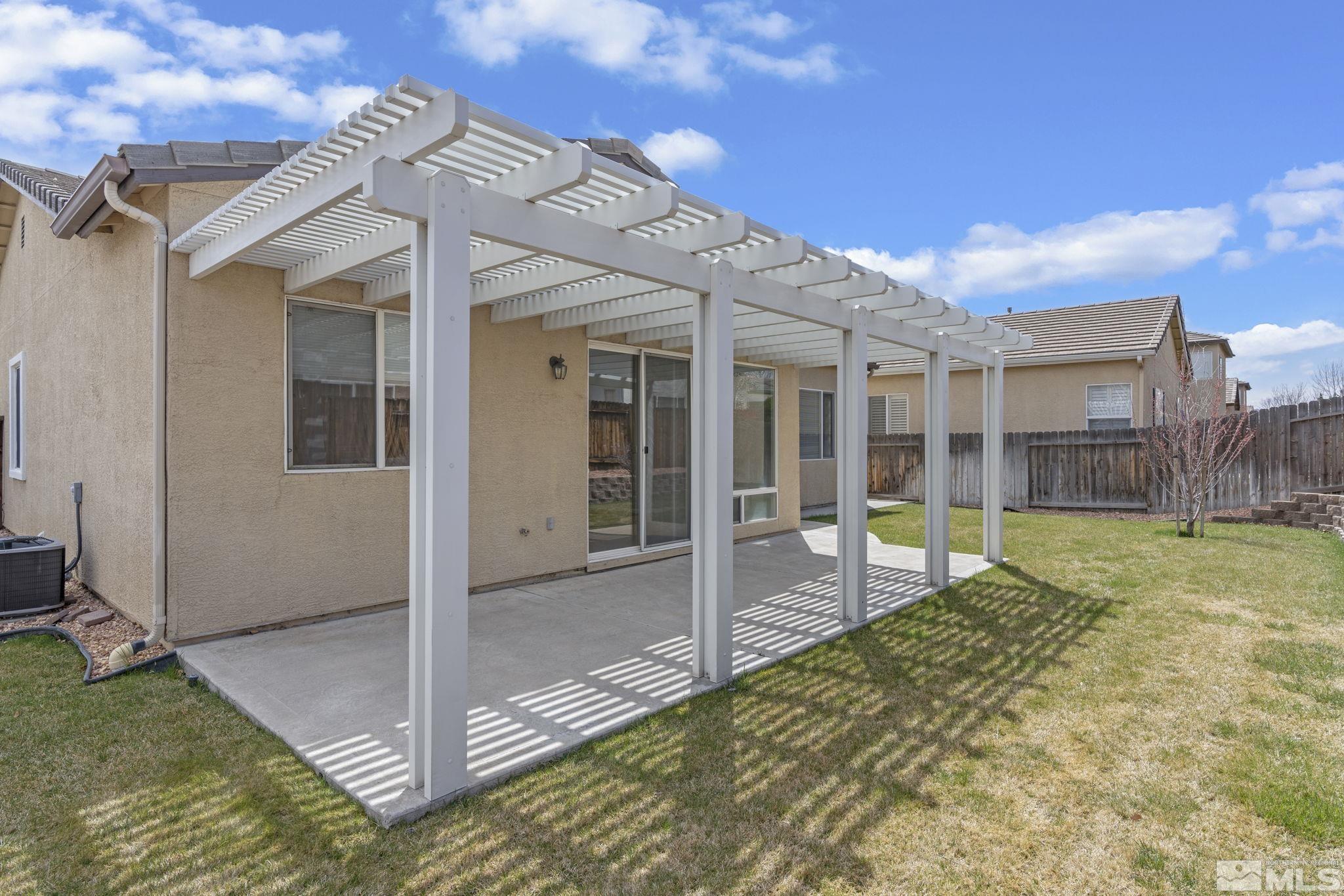 10503 Meeks Bay Court Reno, NV 89521 - Photo 26 of 28 a view of a house with backyard and porch