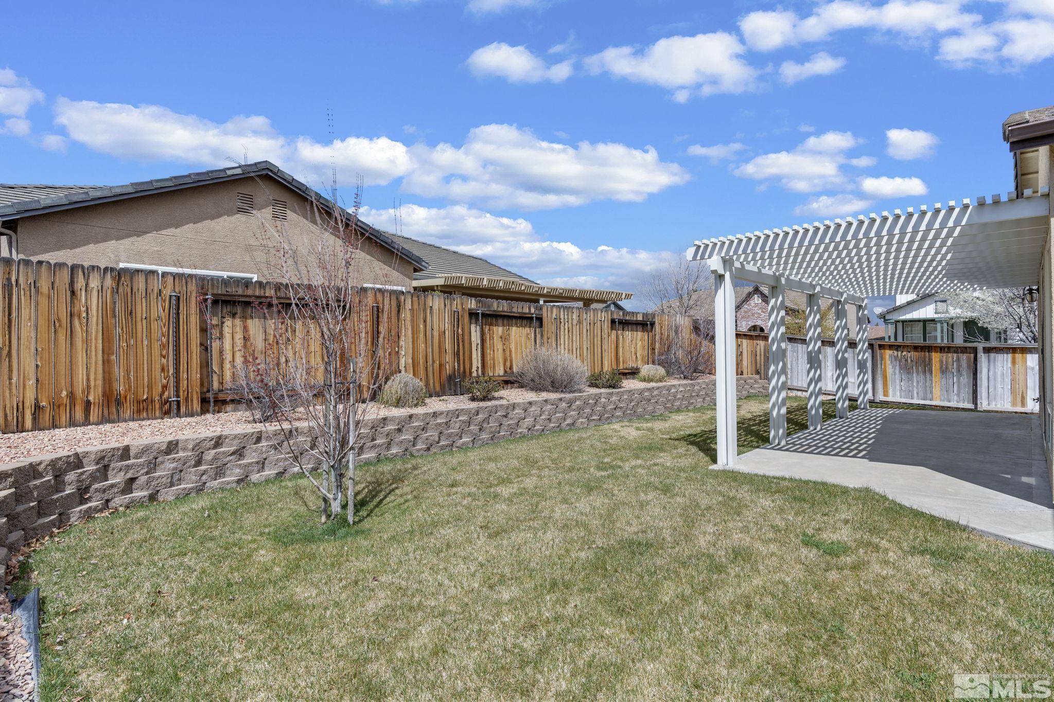 10503 Meeks Bay Court Reno, NV 89521 - Photo 28 of 28 a backyard of a house with table and chairs