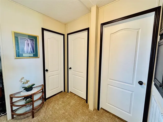 a view of elevator with a hallway