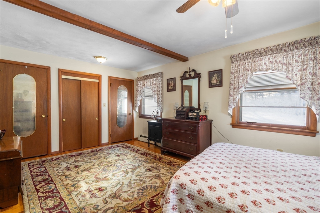 82 Glenwood Road Rutland, MA 01543 - Photo 17 of 30 a bedroom with a bed dresser and a window