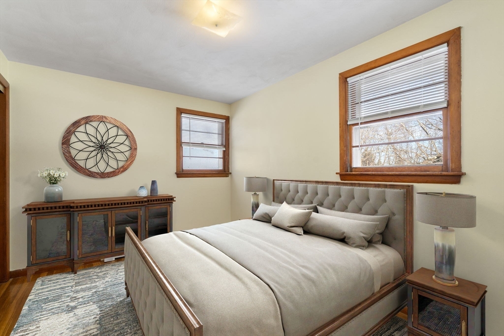 82 Glenwood Road Rutland, MA 01543 - Photo 20 of 30 a bedroom with a bed and a chandelier