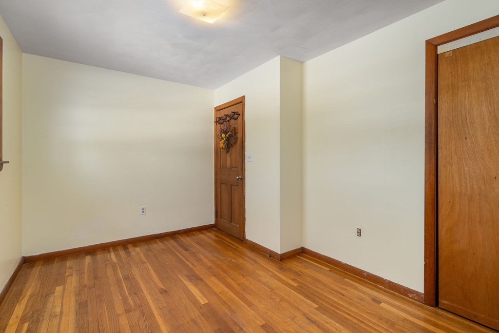 82 Glenwood Road Rutland, MA 01543 - Photo 21 of 30 a view of an empty room with wooden floor